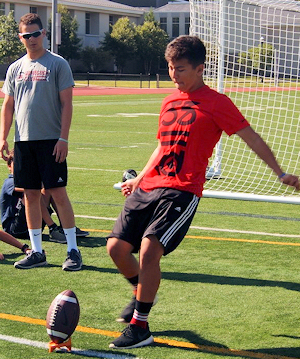 Teen playing football