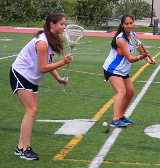 Girls playing lacrosse