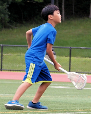 Teen playing lacrosse